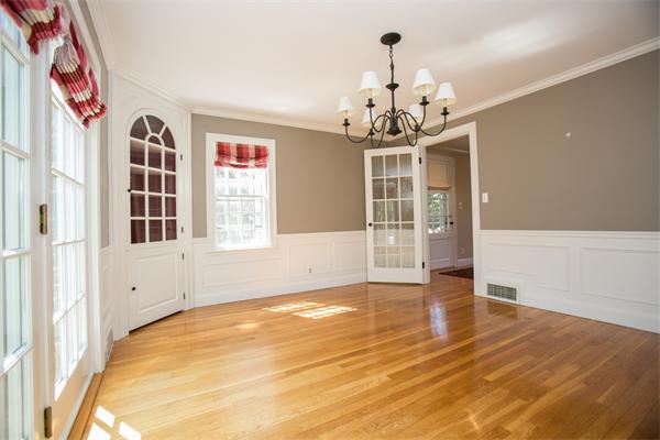 25 Oxbow Road Wellesley, MA 02481 - Photo 4 of 14 a view of an empty room with wooden floor and a window
