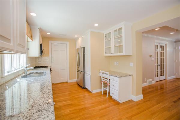 25 Oxbow Road Wellesley, MA 02481 - Photo 7 of 14 a kitchen with a refrigerator sink and cabinets