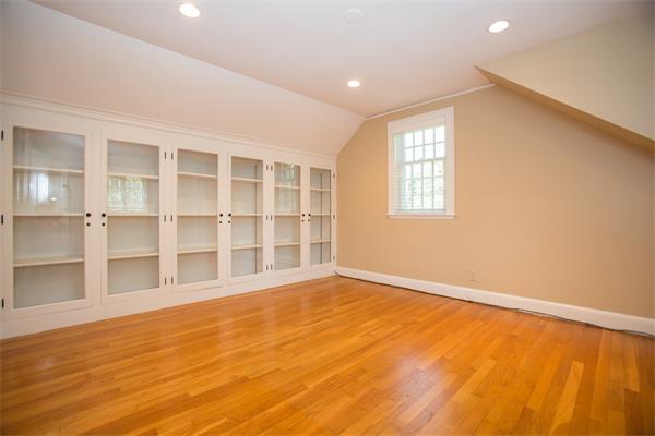 25 Oxbow Road Wellesley, MA 02481 - Photo 8 of 14 a view of an empty room with a window and wooden floor