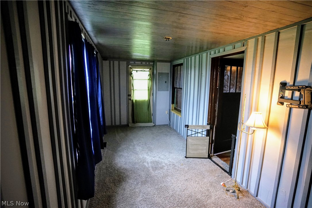 2212 Sentinel Road Dorset, OH 44032 - Photo 22 of 24 Carpeted empty room with wood ceiling