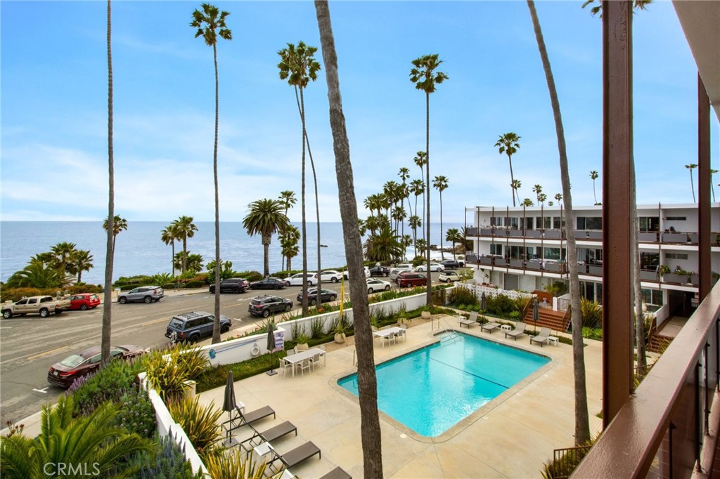 a view of a swimming pool with a lake view