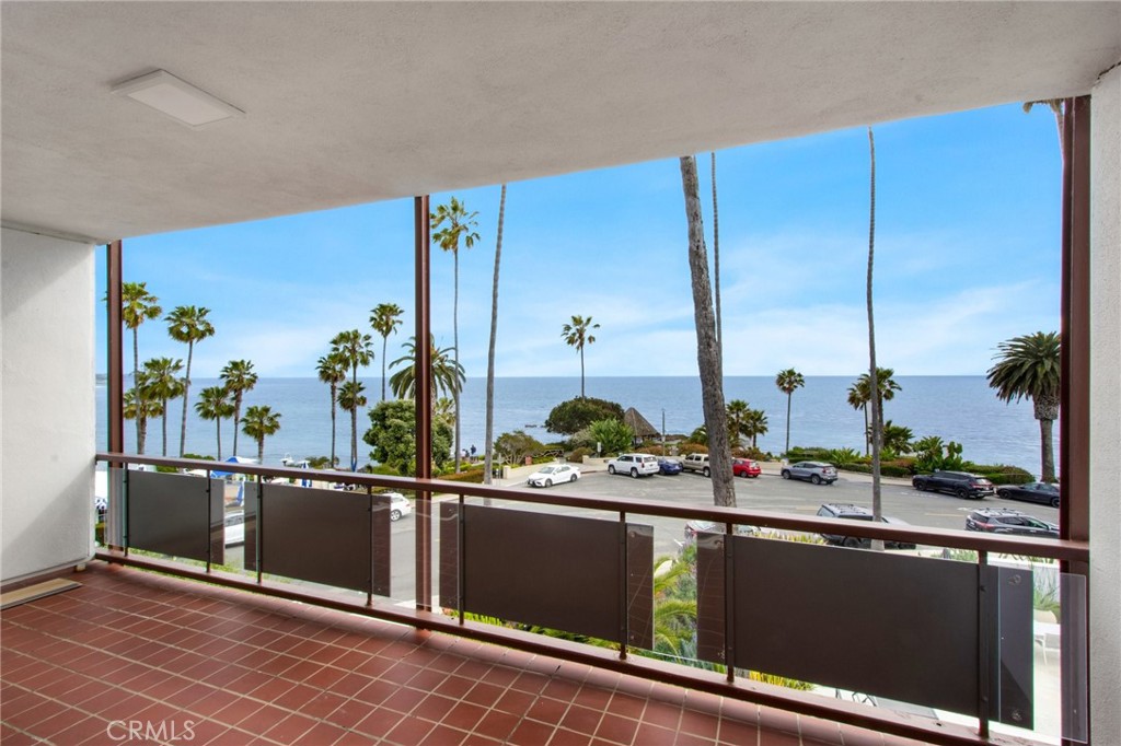 330 Cliff Drive, Unit 308 Laguna Beach, CA 92651 - Photo 3 of 16 a kitchen with stainless steel appliances kitchen island granite countertop a sink and cabinets