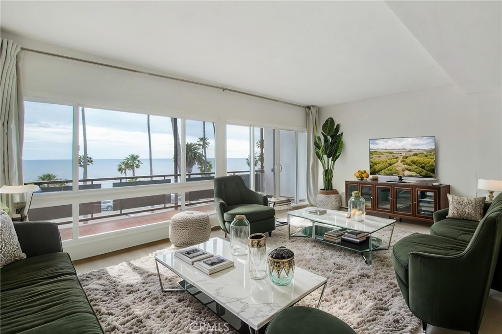 330 Cliff Drive, Unit 308 Laguna Beach, CA 92651 - Photo 5 of 16 a living room with furniture and a large window