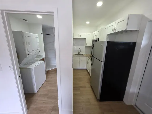 a view of a kitchen with a sink