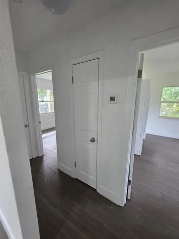 a view of an empty room with a window