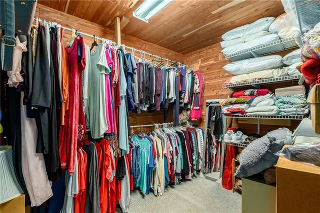 a view of a patio with table and chairs wooden floor and fence