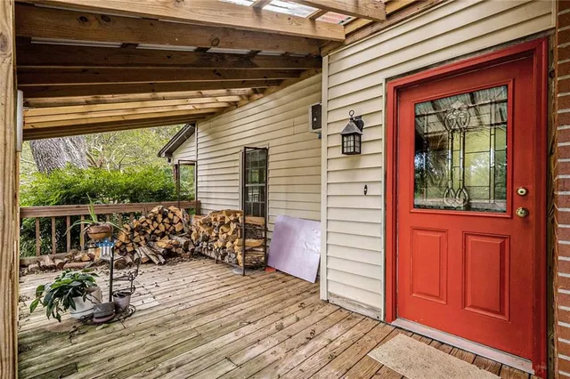 a house with green field in front of it