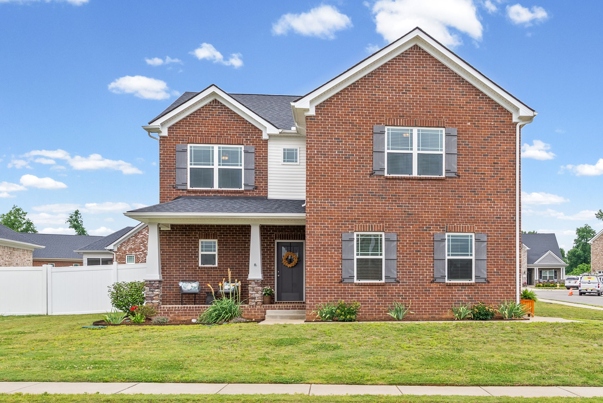 front view of a house with a yard