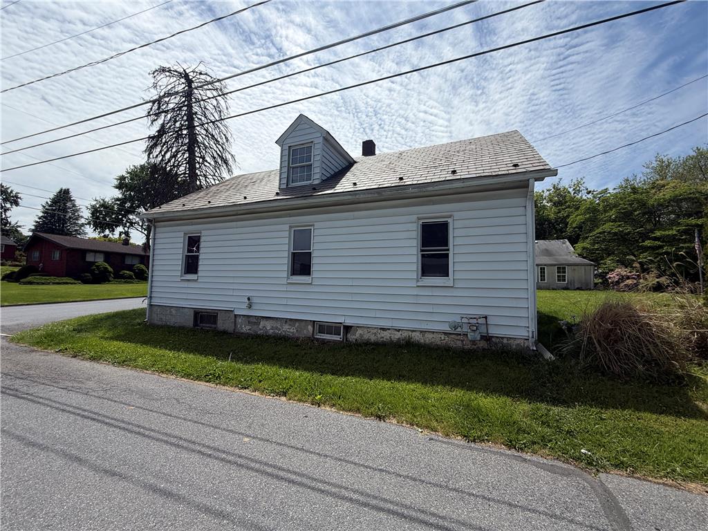 3051 Keystone Street Bethlehem, PA 18020 - Photo 3 of 18 A well-maintained side exterior boasts durable siding and a classic dormer, offering charm and function.
