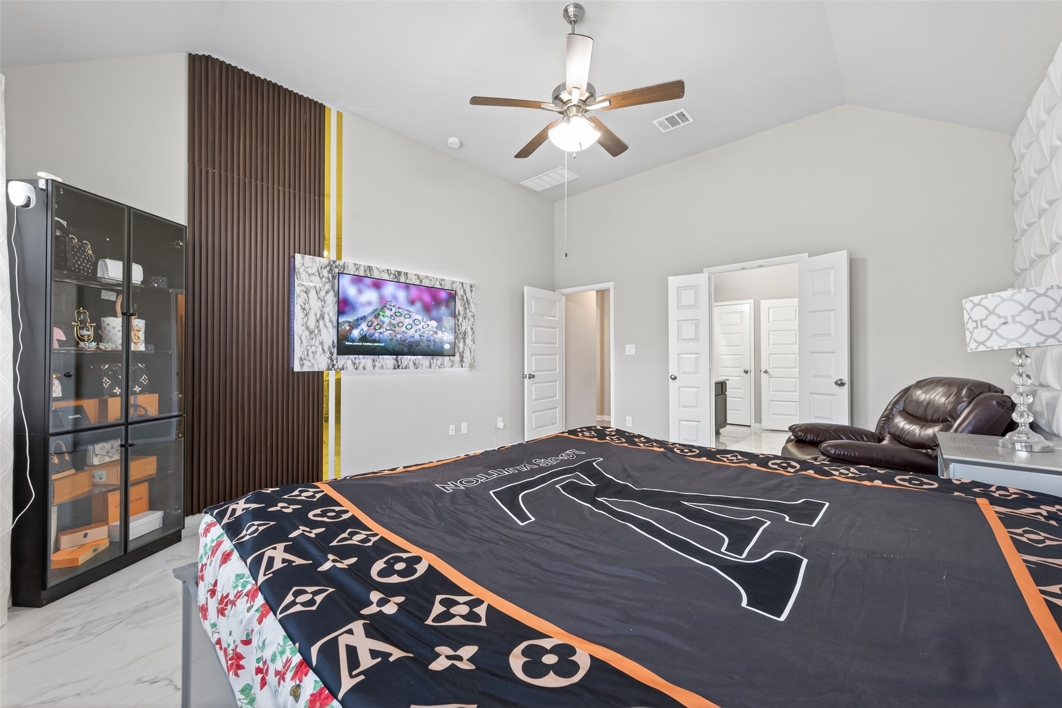 22409 Kinley Street New Caney, TX 77357 - Photo 28 of 46 a bedroom with a bed and wooden floor