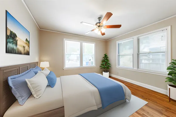 a bedroom with bed and window