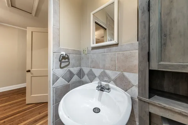 a bathroom with a sink and a mirror