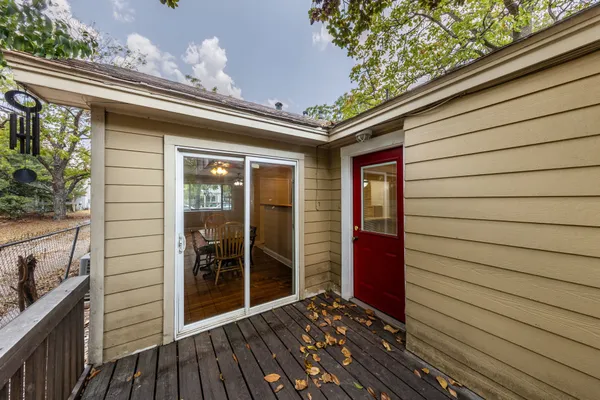 a view of a porch with wooden floor and iron walls