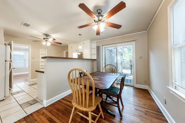 a dining room with furniture and window