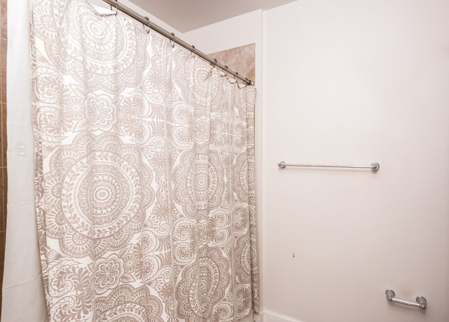 901 West Madison Street, Unit 404 Chicago, IL 60607 - Photo 10 of 12 a bathroom with a shower curtain