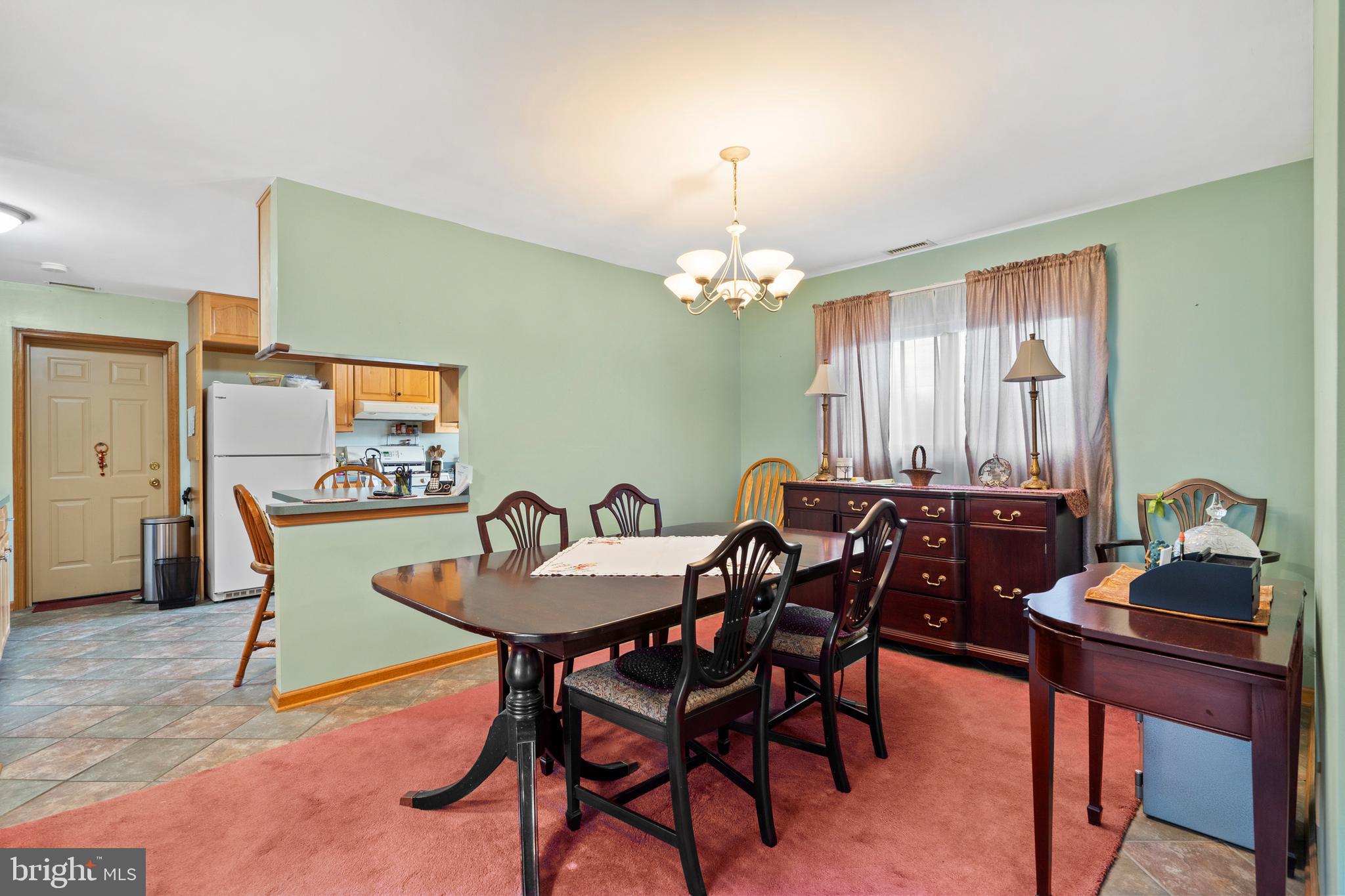 164 Trenton Road Langhorne, PA 19047 - Photo 13 of 51 a view of a dining room with furniture and chandelier