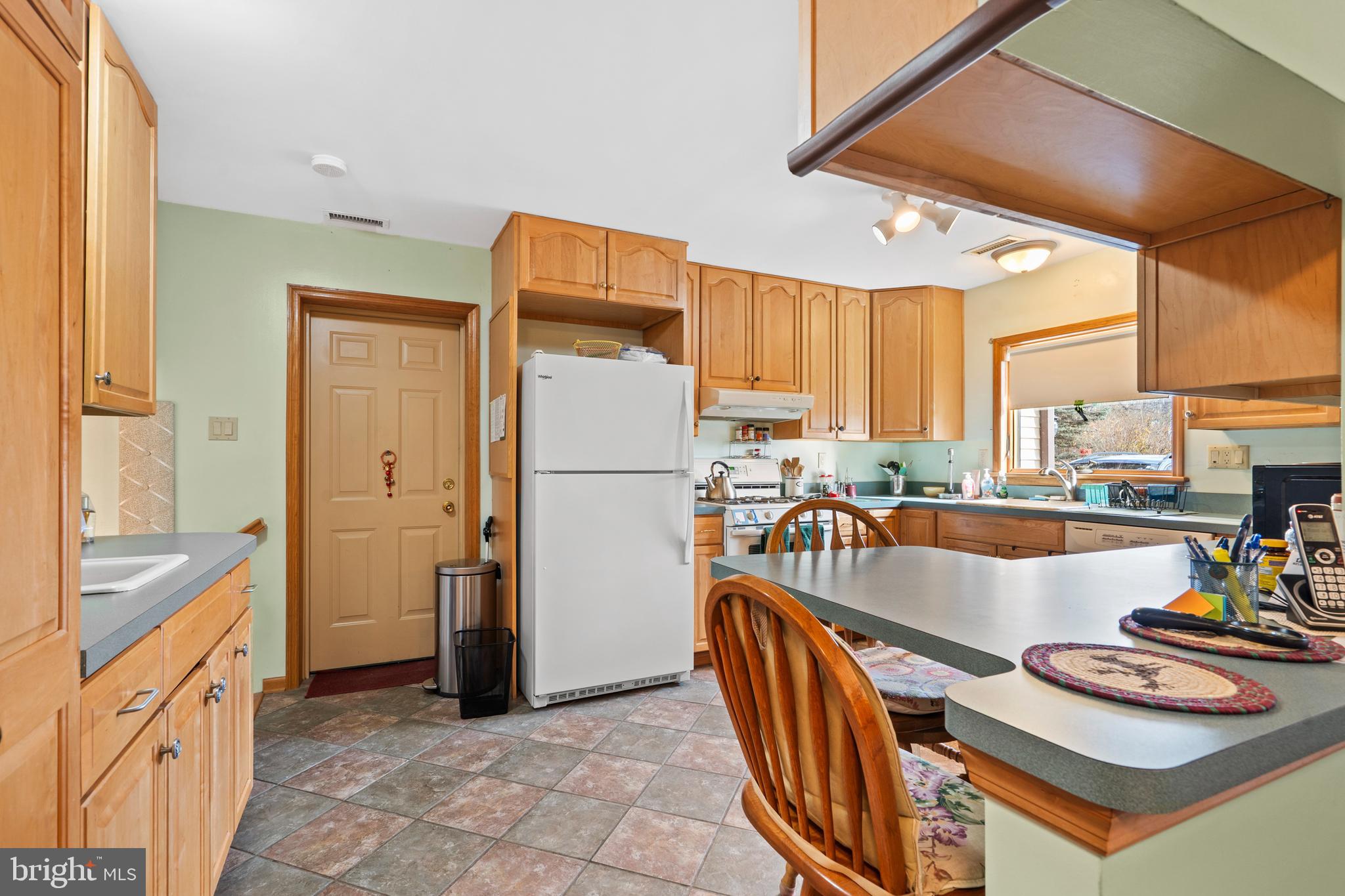 164 Trenton Road Langhorne, PA 19047 - Photo 14 of 51 a kitchen with stainless steel appliances granite countertop a refrigerator and a stove