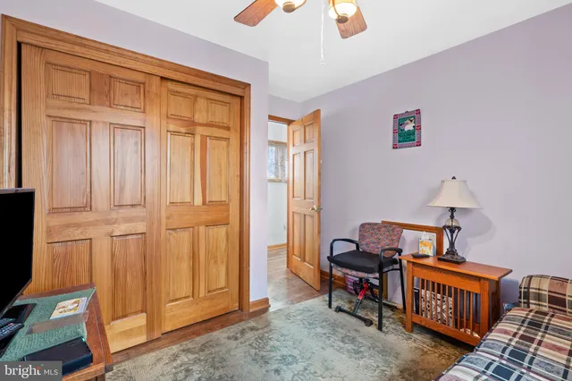 a bedroom with furniture and a window
