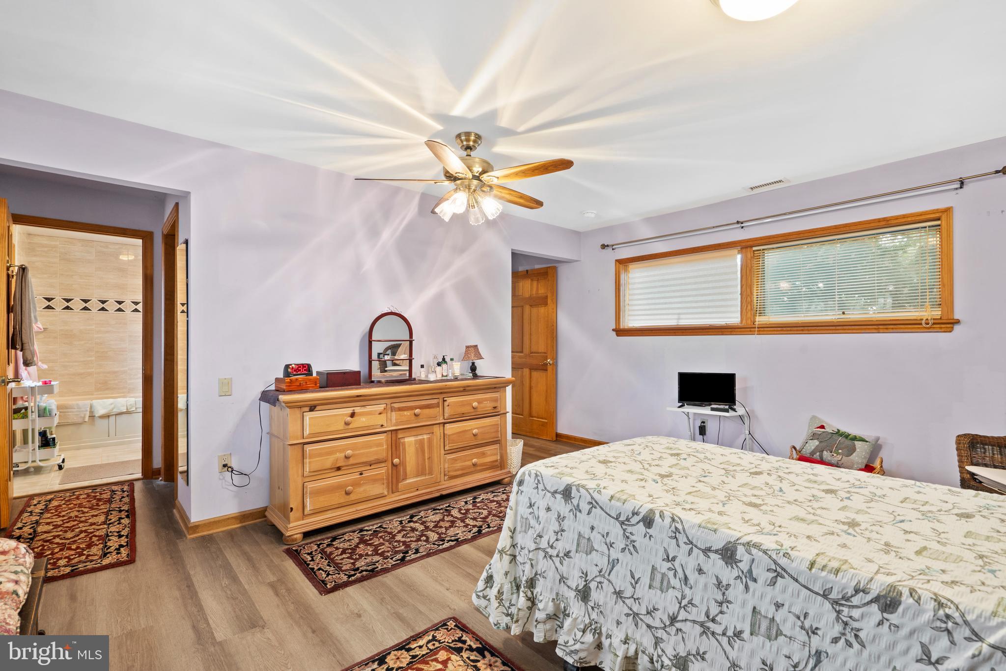 164 Trenton Road Langhorne, PA 19047 - Photo 23 of 51 a bedroom with a bed and a chandelier
