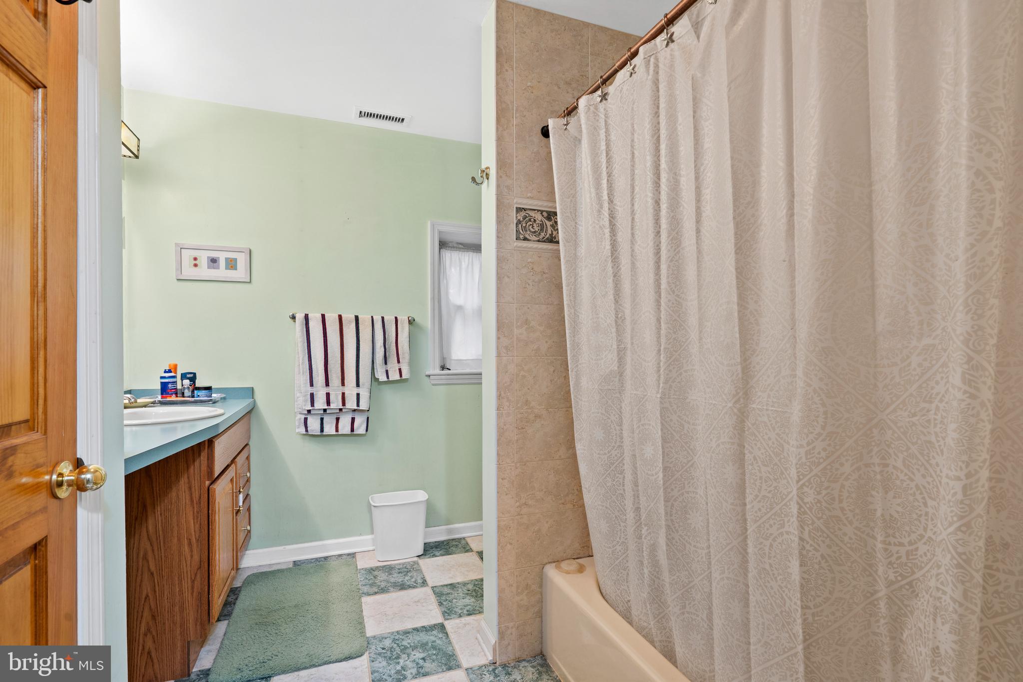 164 Trenton Road Langhorne, PA 19047 - Photo 30 of 51 a bathroom with a toilet a sink and curtain