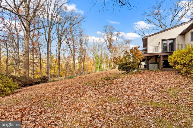 a pathway of a house with a yard
