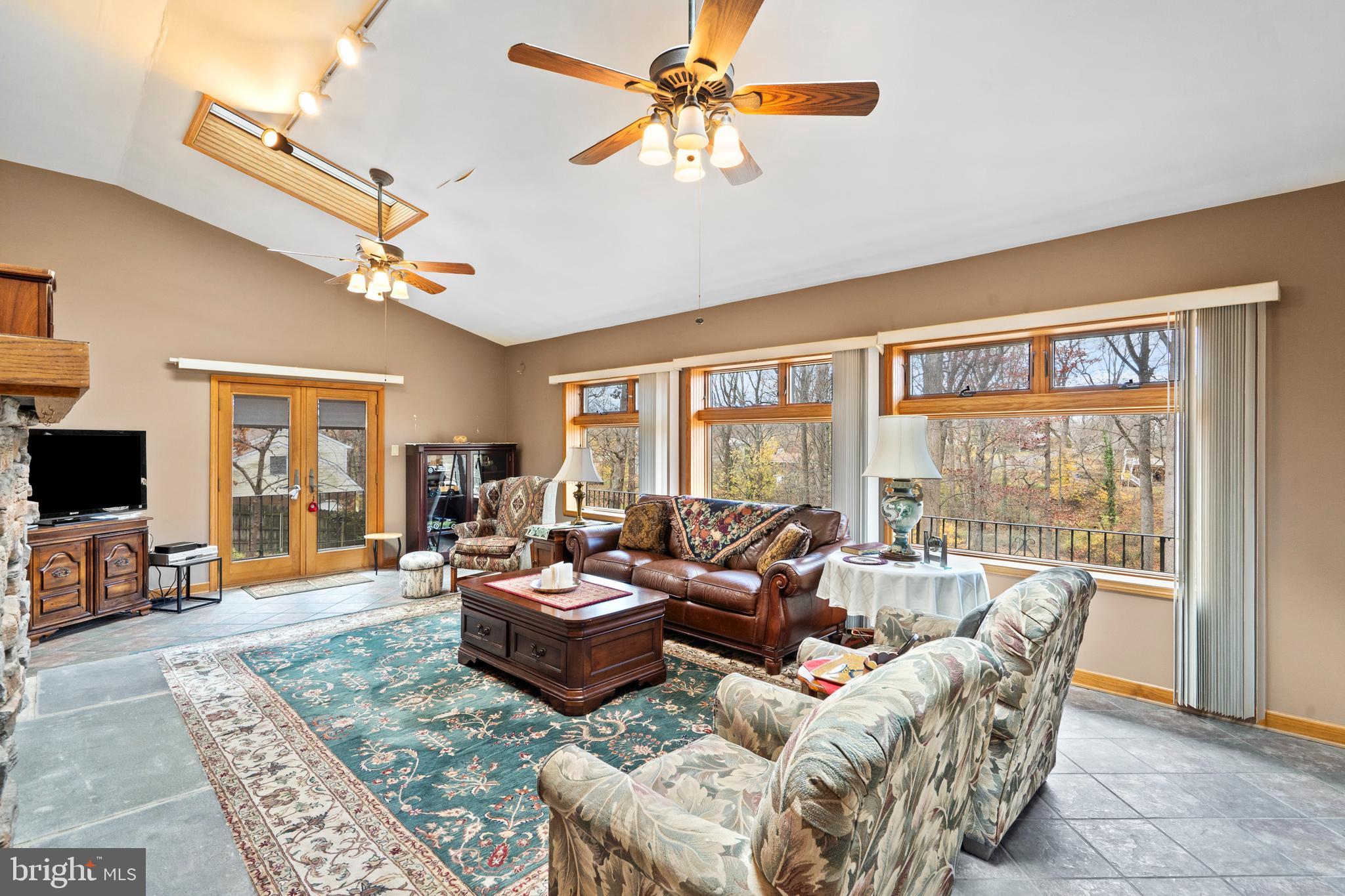 164 Trenton Road Langhorne, PA 19047 - Photo 7 of 51 a living room with furniture large window and a flat screen tv