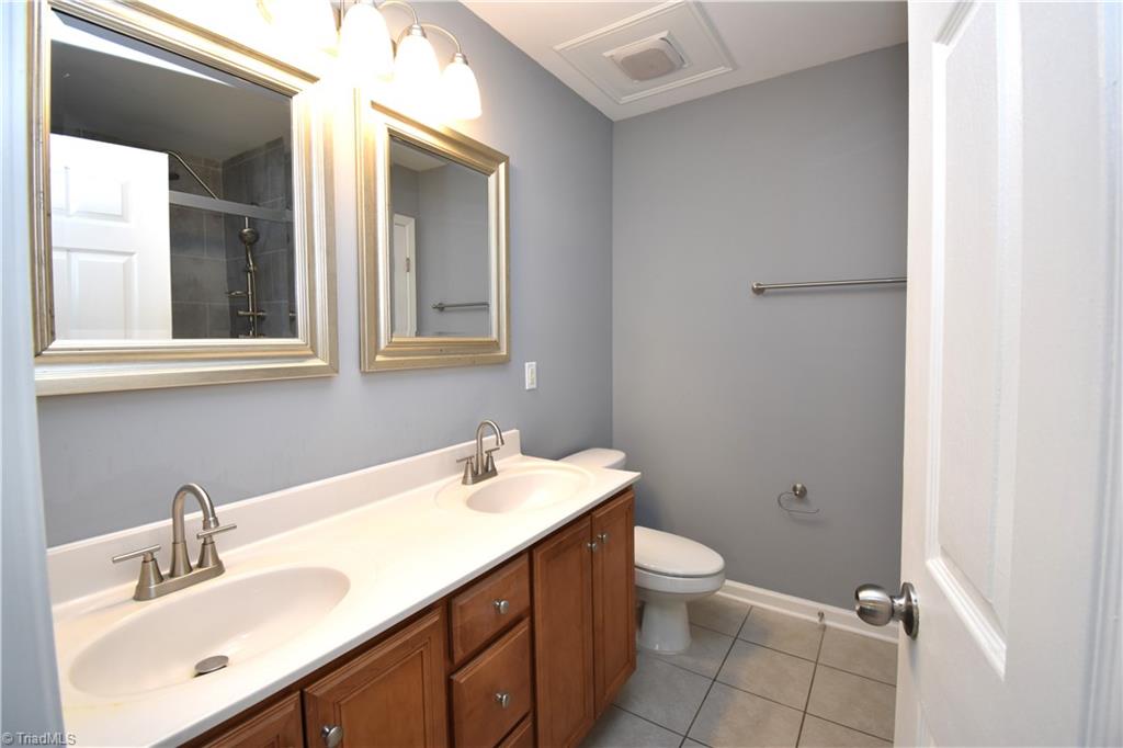 3910 Ribbon Grass Terrace Greensboro, NC 27405 - Photo 15 of 24 The en-suite for the primary bedroom