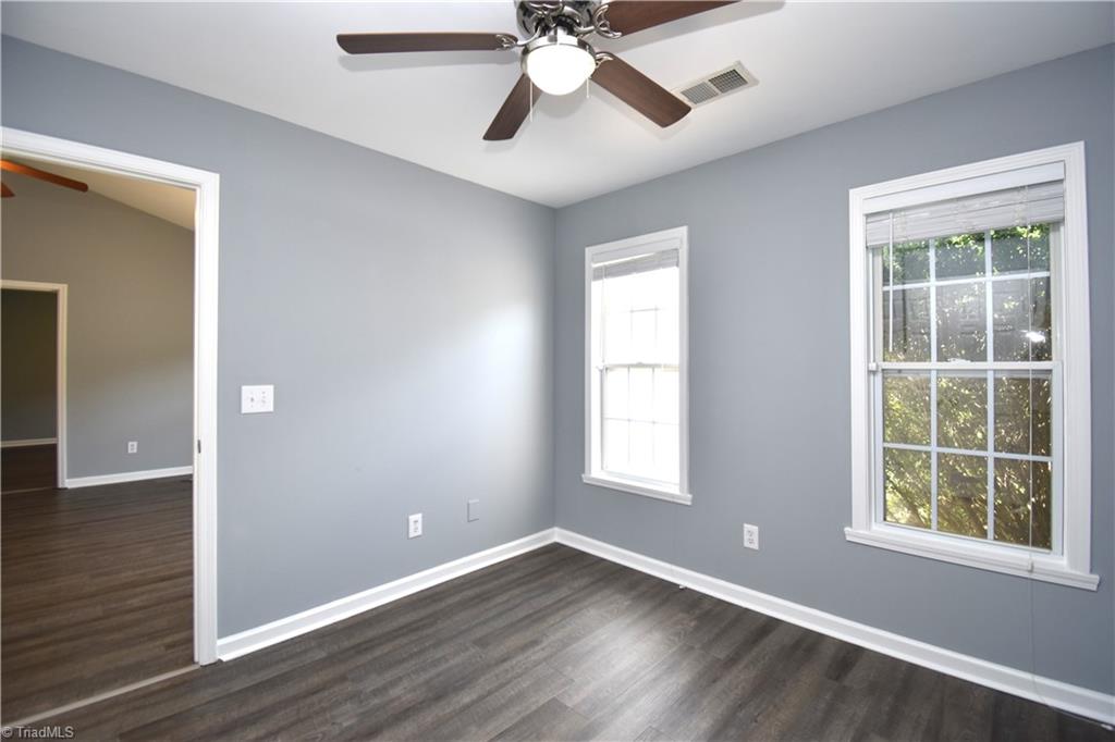 3910 Ribbon Grass Terrace Greensboro, NC 27405 - Photo 19 of 24 The rear guest bedroom is across the living room from the primary bedroom.