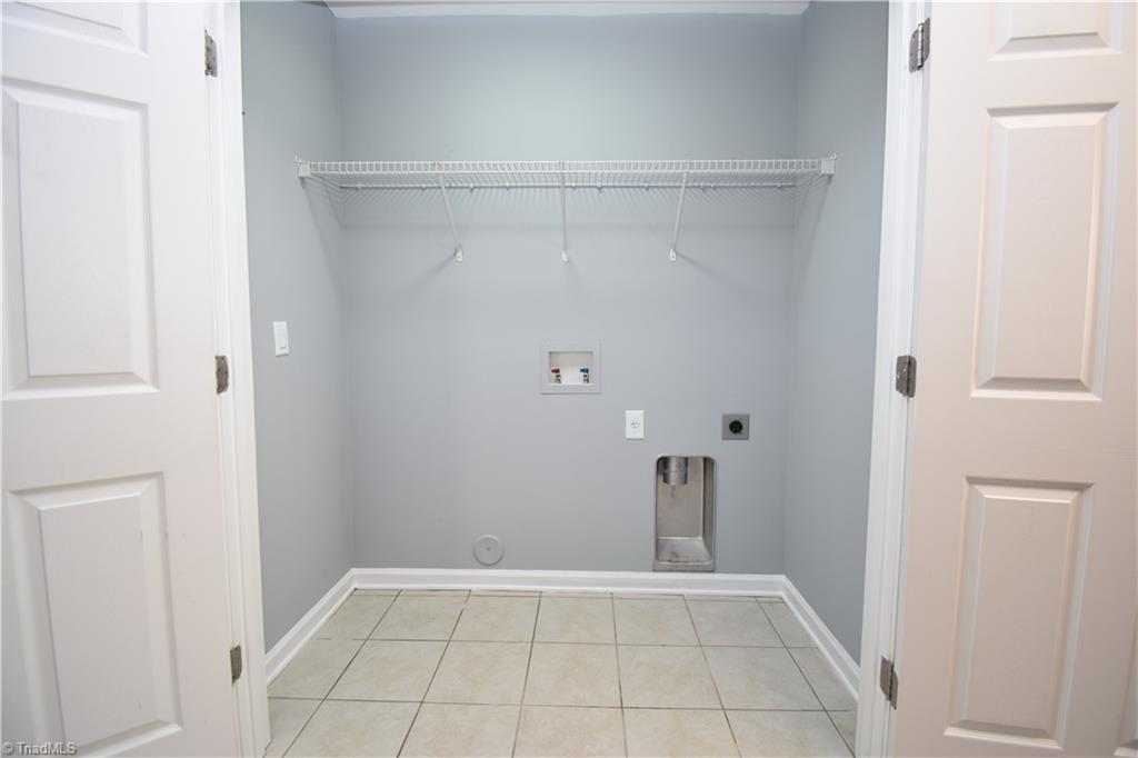 3910 Ribbon Grass Terrace Greensboro, NC 27405 - Photo 22 of 24 The laundry area is ready for its job.