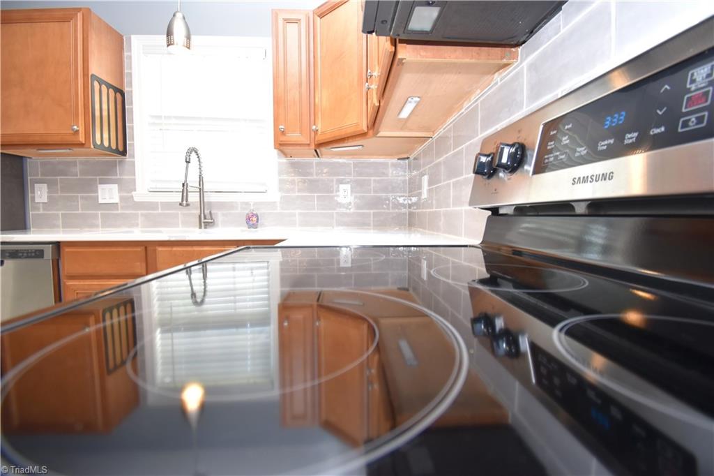 3910 Ribbon Grass Terrace Greensboro, NC 27405 - Photo 10 of 24 The under cabinet lights are battery operated to avoid messy cords.