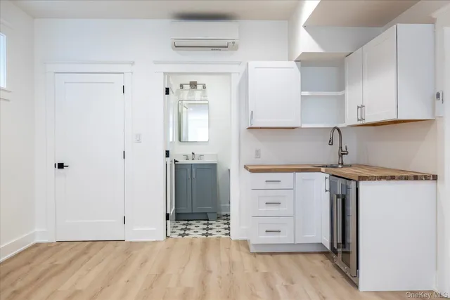 a view of kitchen with white cabinets