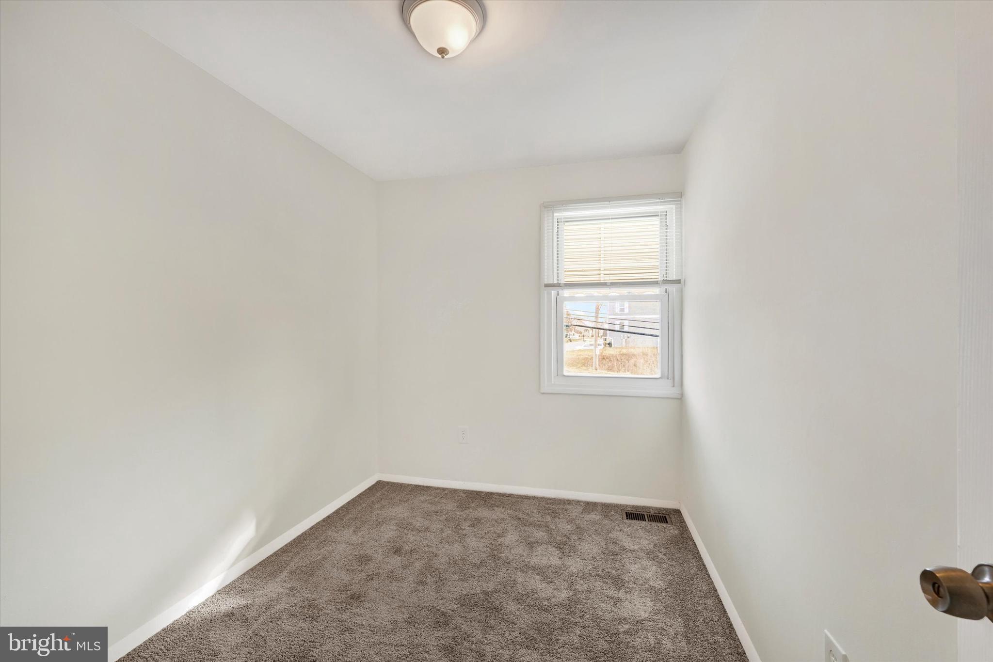 4436 Annapolis Road Halethorpe, MD 21227 - Photo 18 of 30 a view of an empty room and window