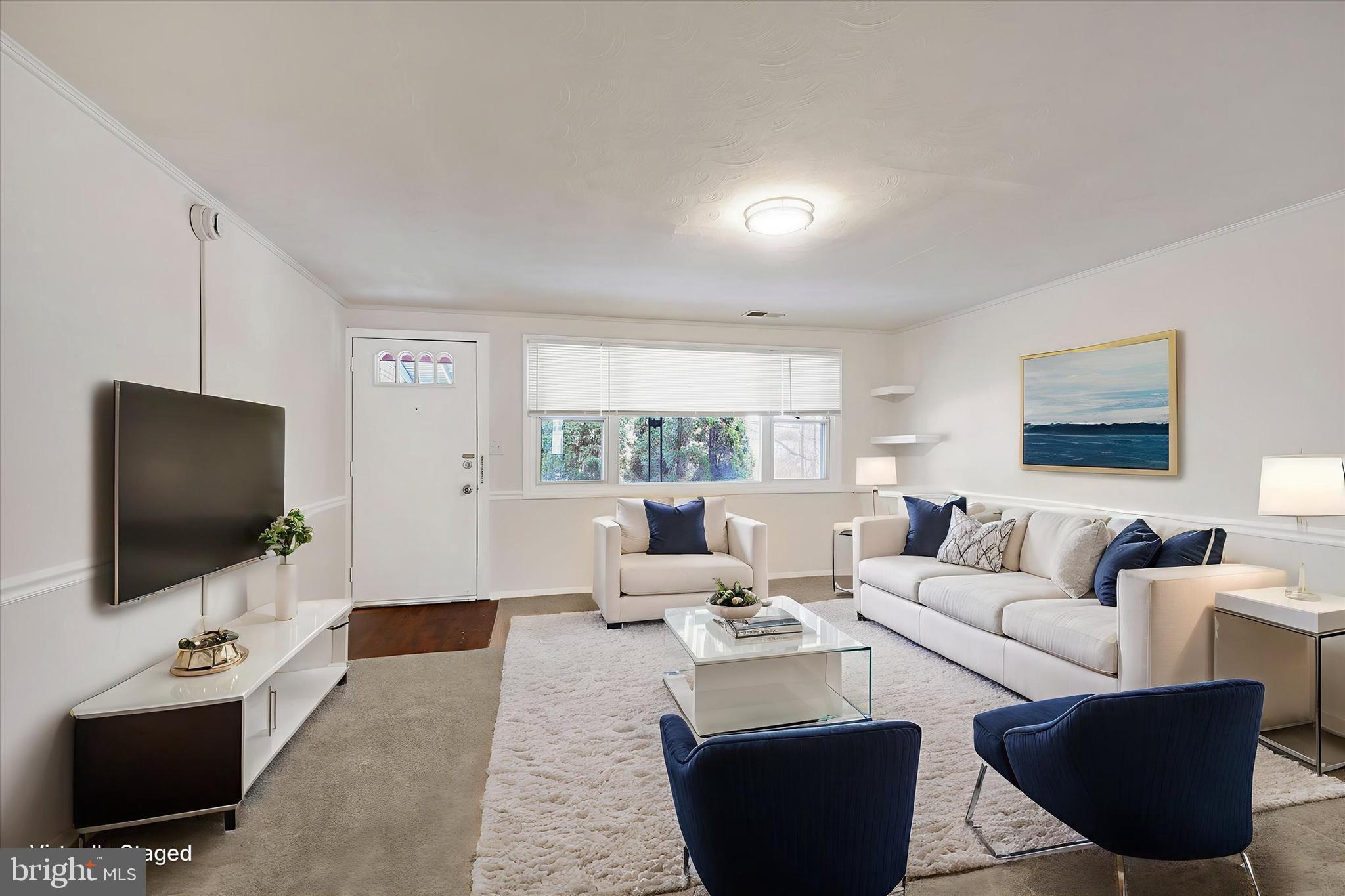 4436 Annapolis Road Halethorpe, MD 21227 - Photo 2 of 30 a living room with furniture and a flat screen tv