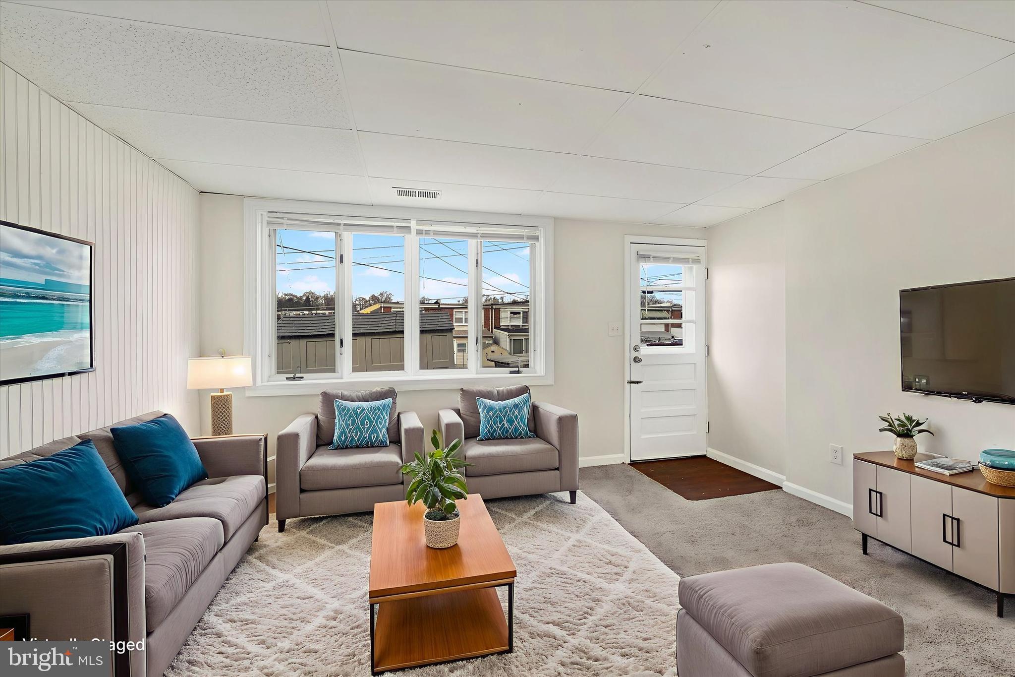 4436 Annapolis Road Halethorpe, MD 21227 - Photo 4 of 30 a living room with furniture and a flat screen tv