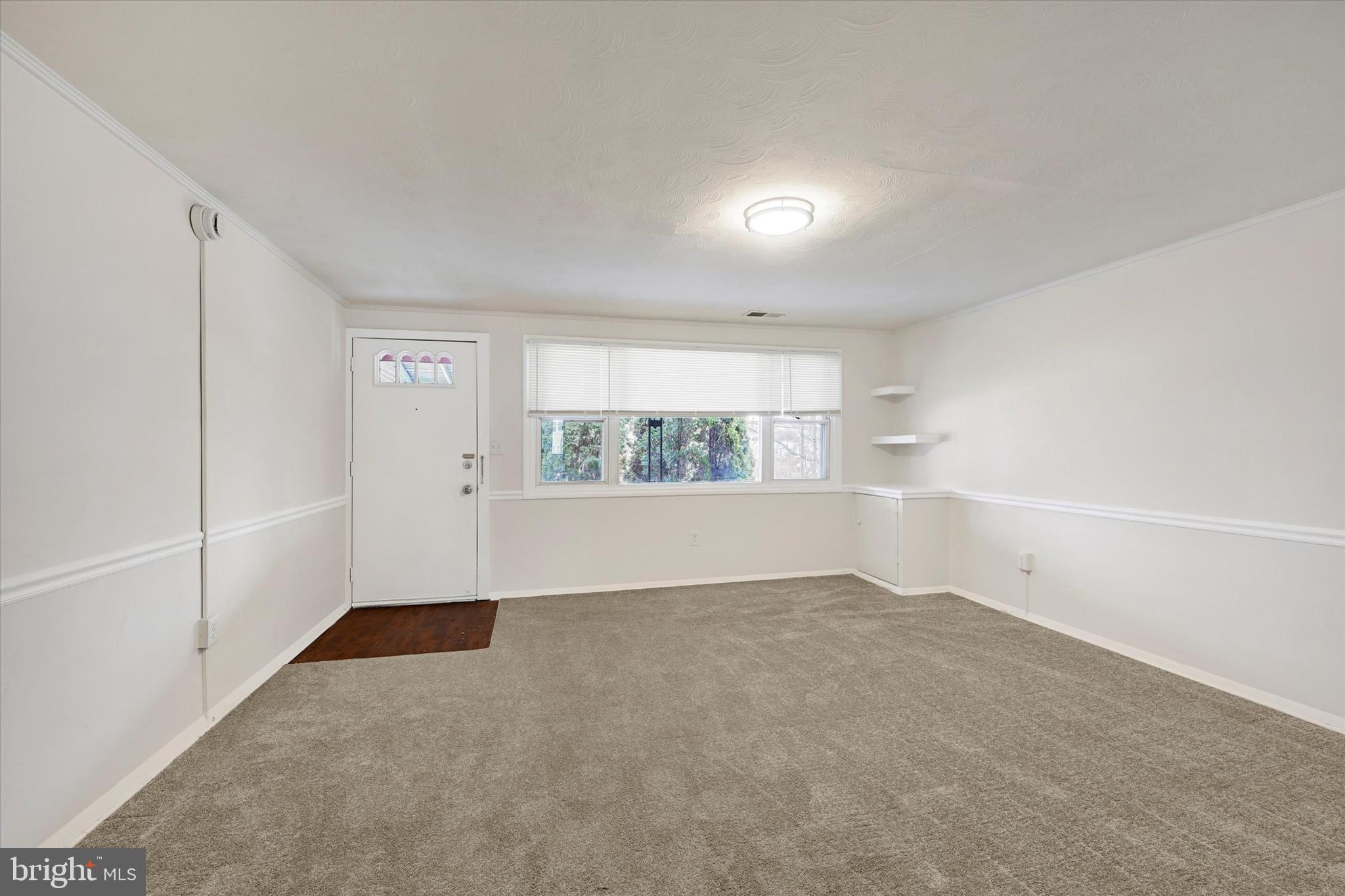 4436 Annapolis Road Halethorpe, MD 21227 - Photo 7 of 30 an empty room with a empty space and windows