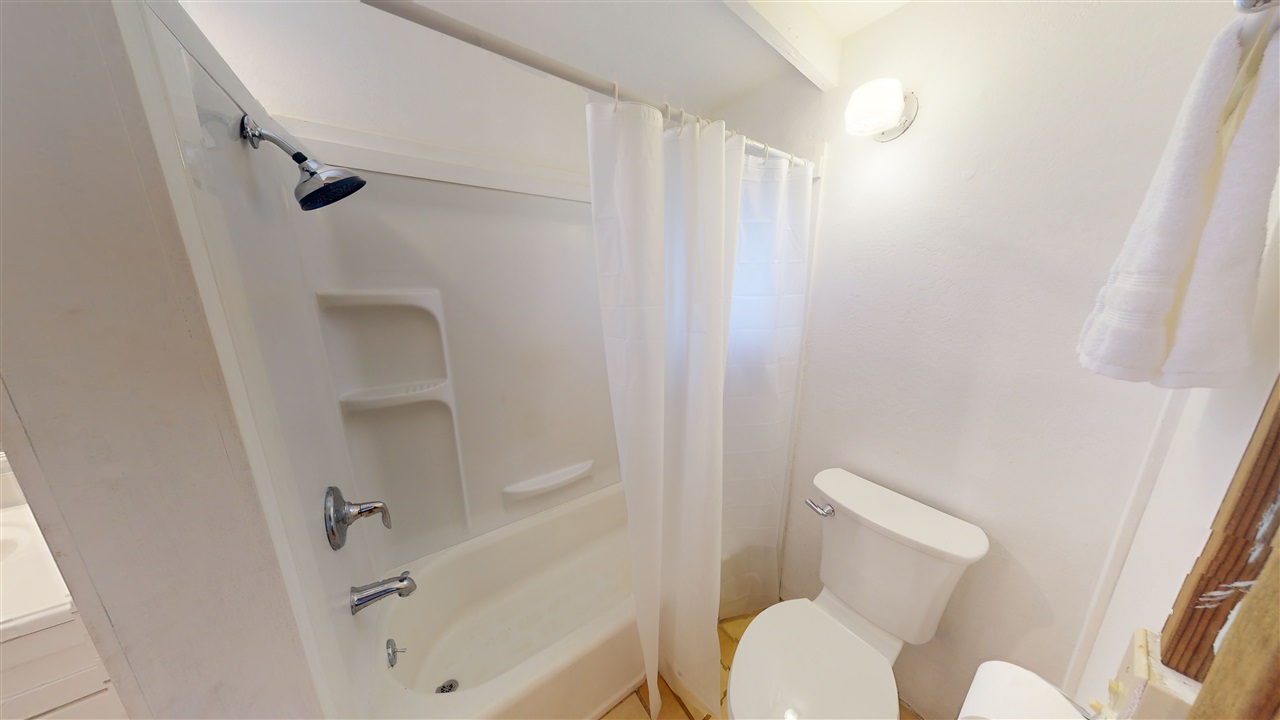 307 West Kuiaha Road Haiku, HI 96708 - Photo 14 of 30 a white toilet sitting next to a bathroom sink