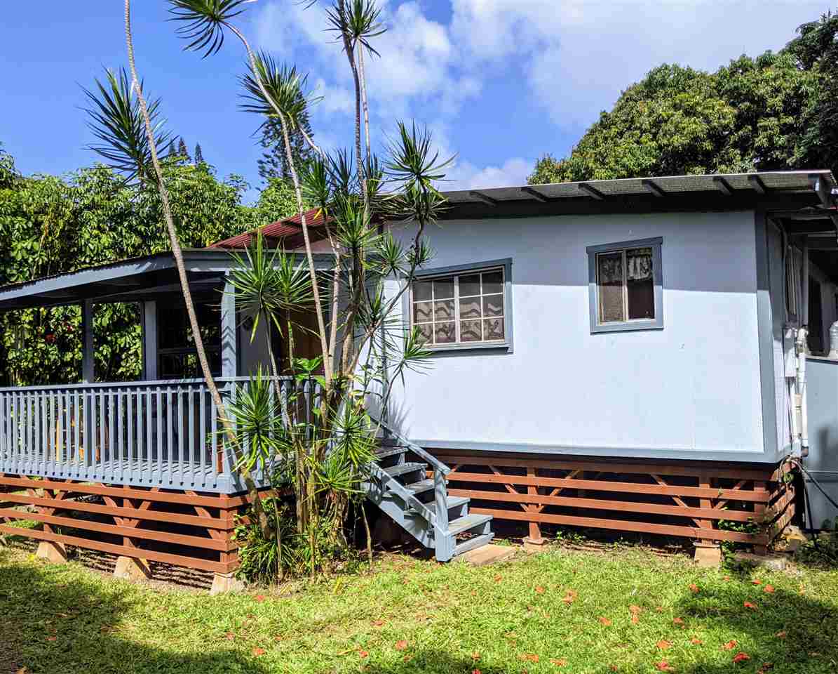 307 West Kuiaha Road Haiku, HI 96708 - Photo 2 of 30 a front view of a house with garden