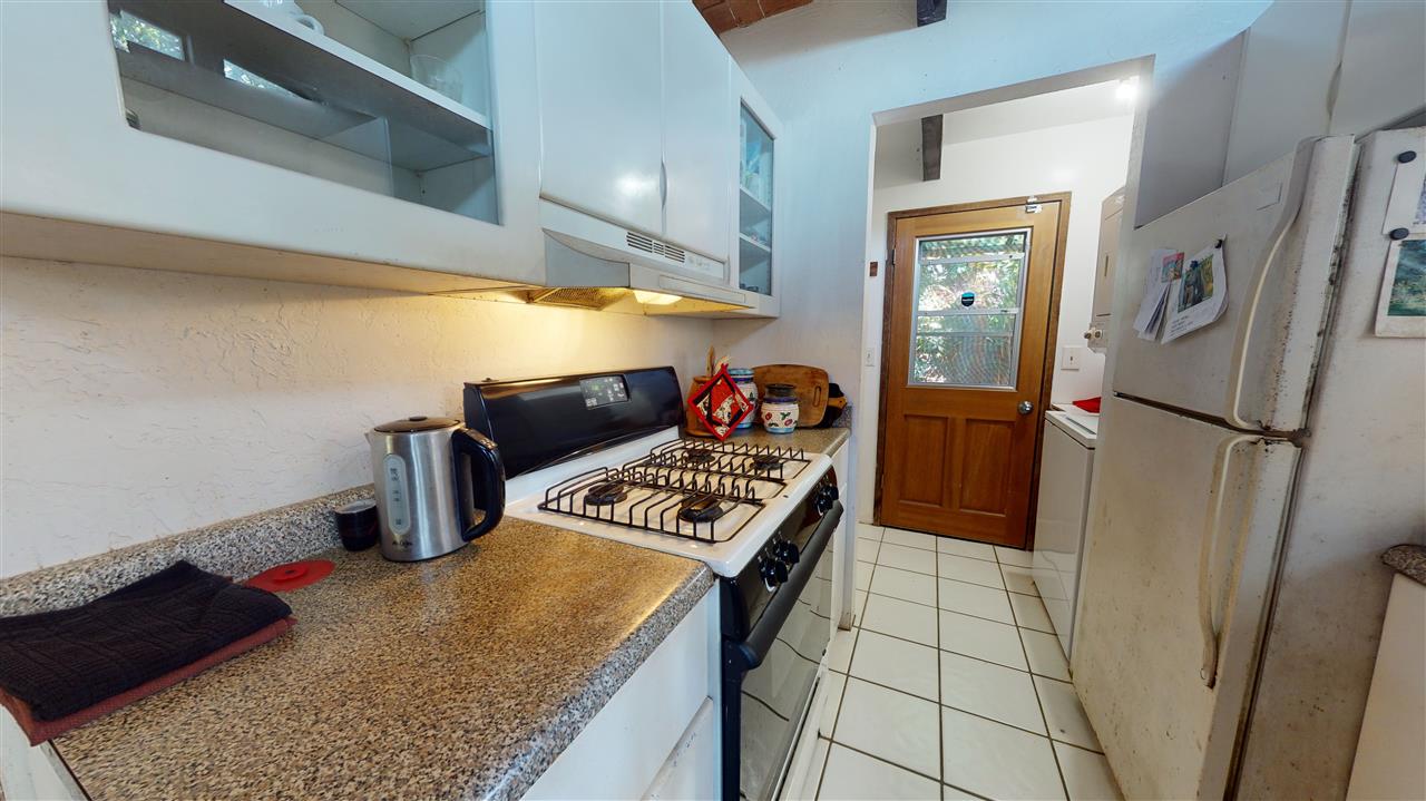 307 West Kuiaha Road Haiku, HI 96708 - Photo 22 of 30 a kitchen with stainless steel appliances granite countertop a refrigerator and a stove