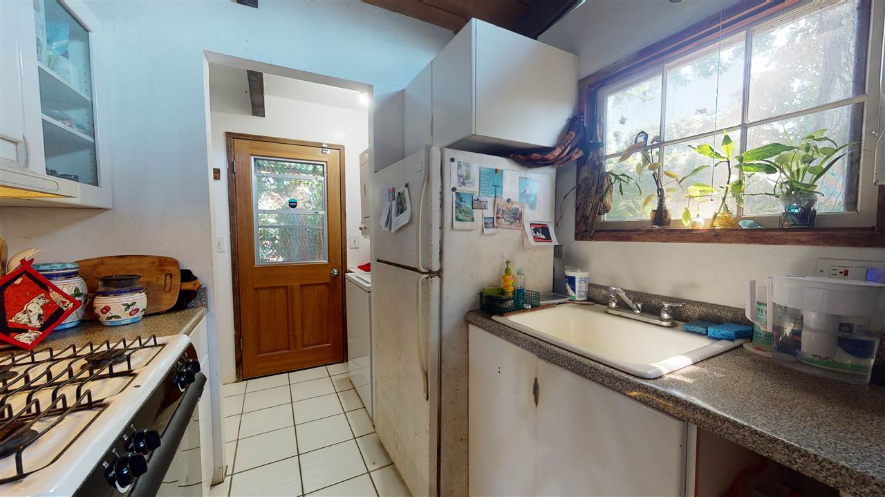 307 West Kuiaha Road Haiku, HI 96708 - Photo 23 of 30 a kitchen that has a sink and a stove in it