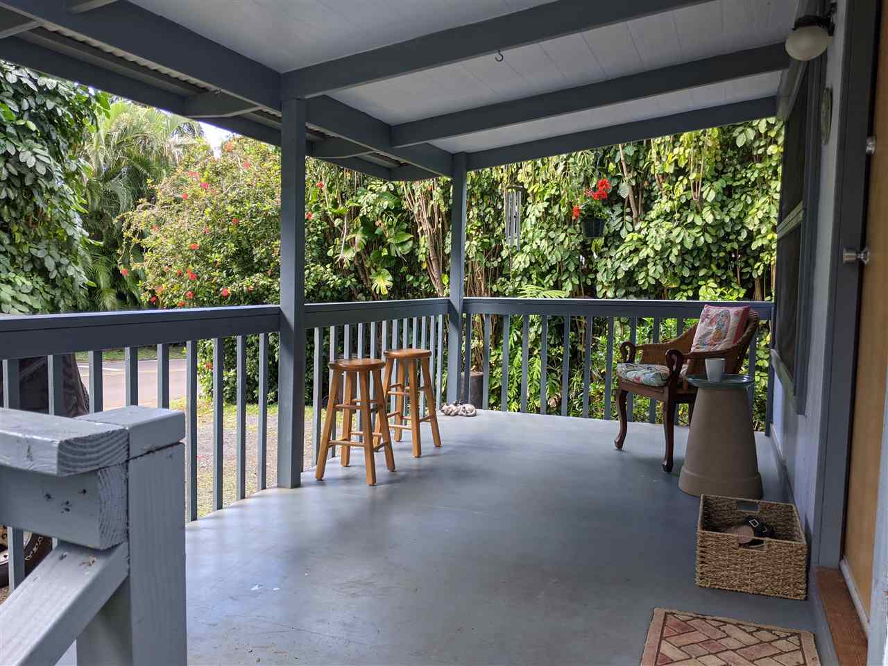 307 West Kuiaha Road Haiku, HI 96708 - Photo 5 of 30 a view of a porch with wooden floor and outdoor seating