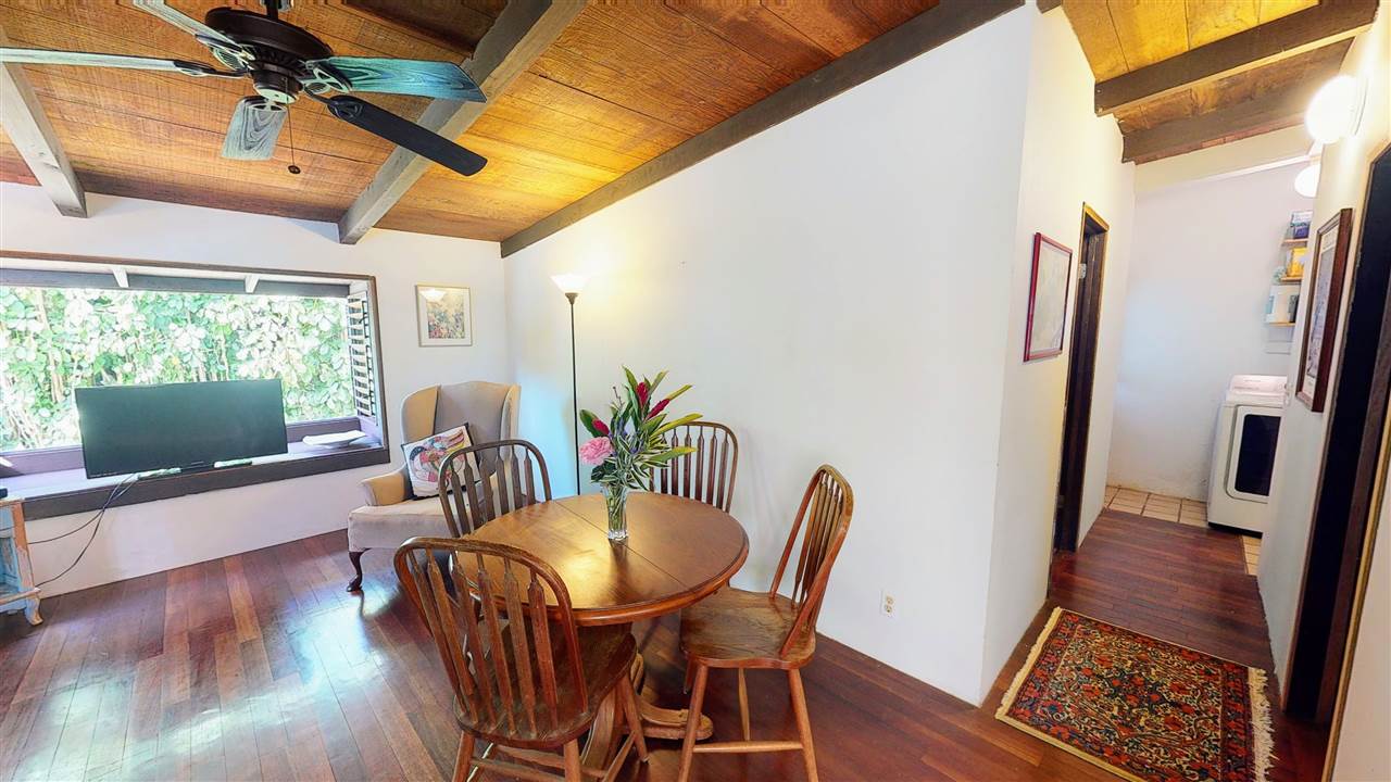 307 West Kuiaha Road Haiku, HI 96708 - Photo 7 of 30 a view of a dining room with furniture window and wooden floor