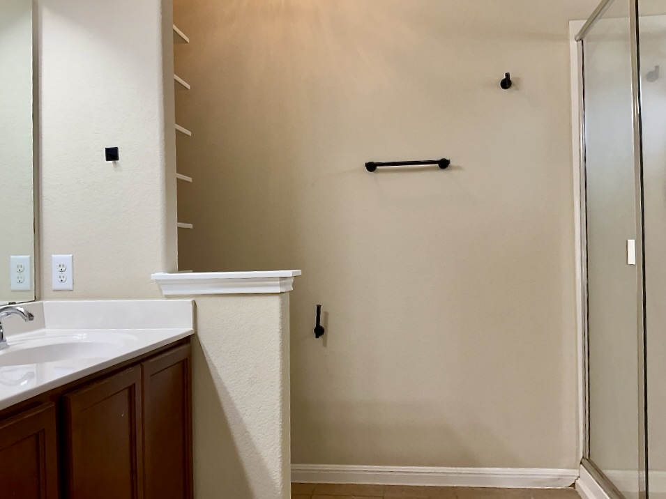 720 Noatak Trail Pflugerville, TX 78660 - Photo 12 of 20 a bathroom with a sink and a mirror