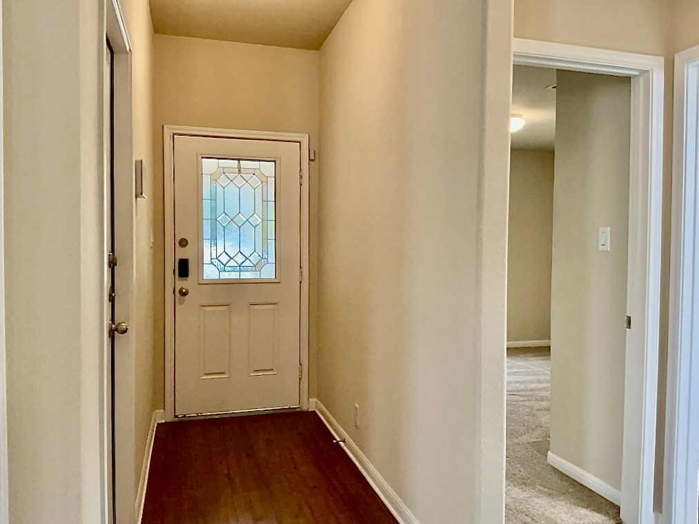 720 Noatak Trail Pflugerville, TX 78660 - Photo 3 of 20 a view of a hallway with wooden floor
