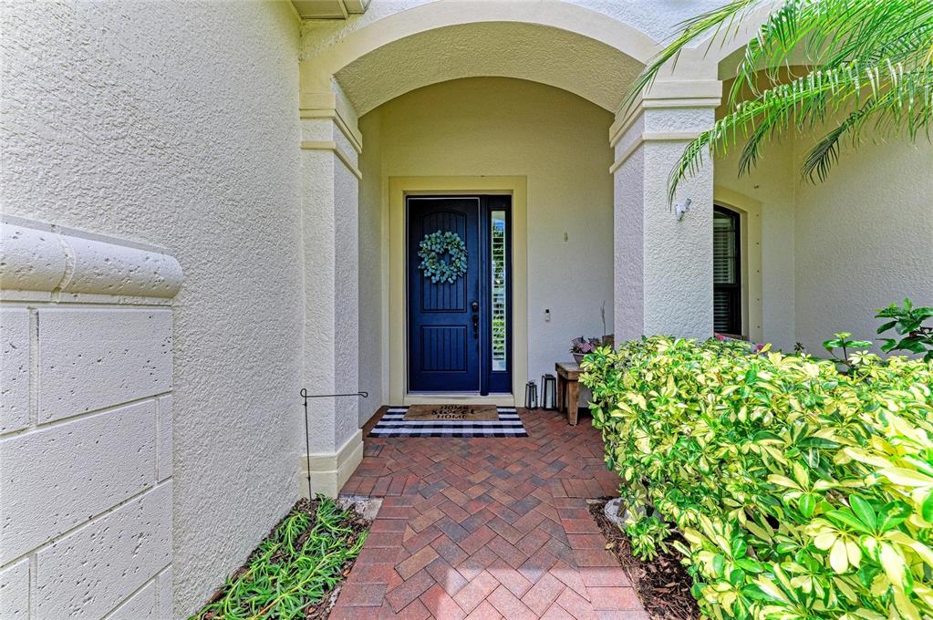 12642 Harney Street Venice, FL 34293 - Photo 5 of 85 a front view of a house with a garden