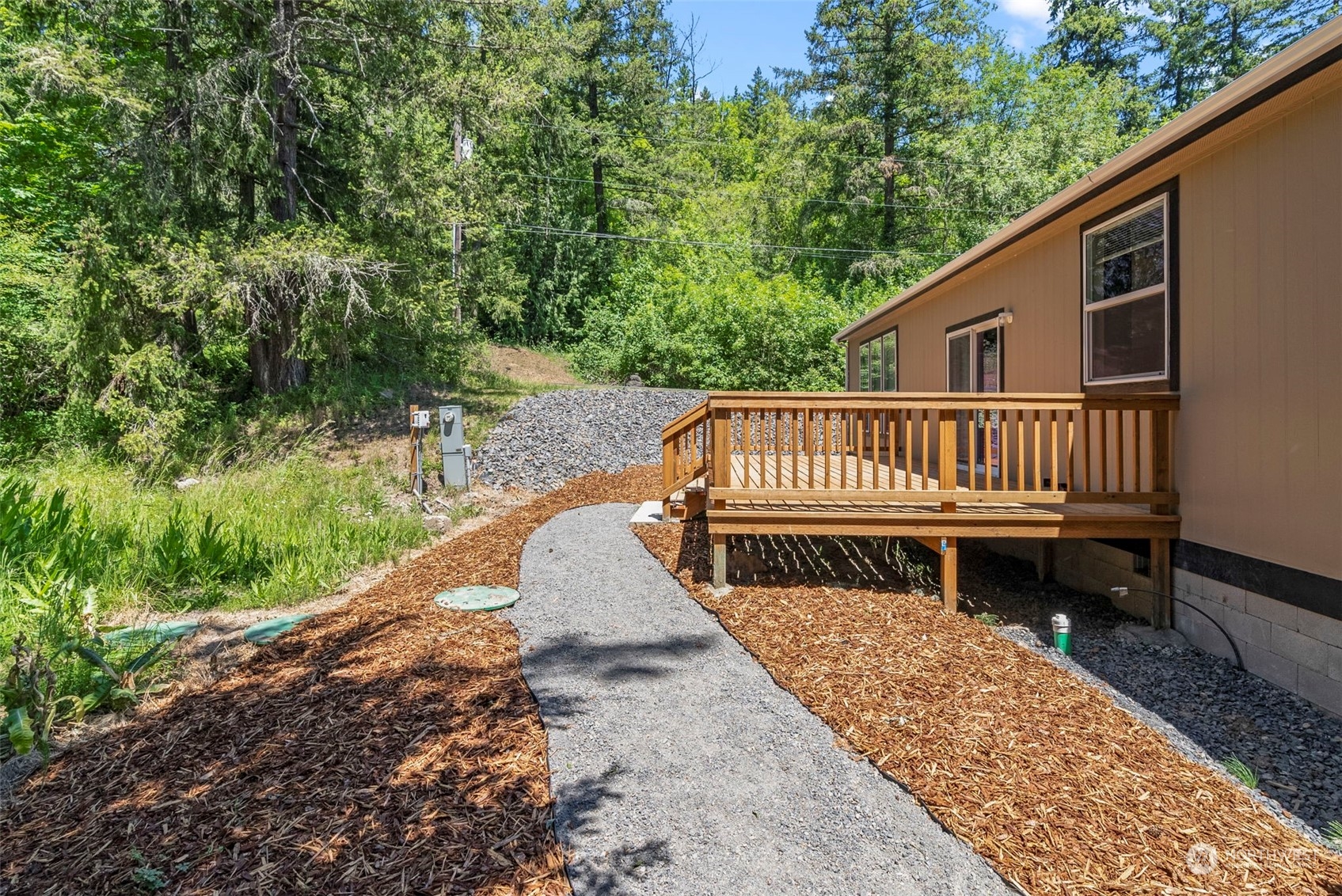 157-p G P G Sweet Road Kelso, WA 98626 - Photo 14 of 35 a view of a wooden deck with a bench