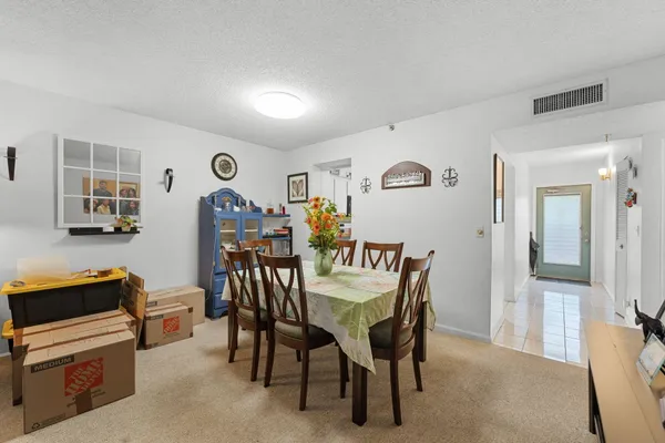 a view of a dining room with furniture