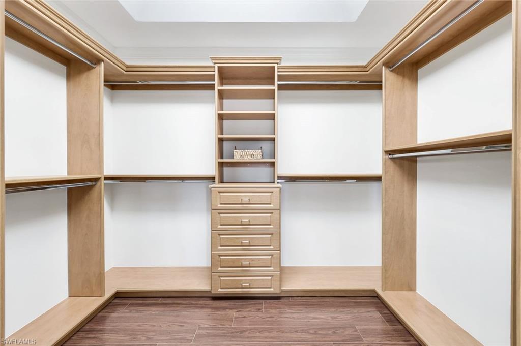 309 Rookery Court Marco Island, FL 34145 - Photo 22 of 49 a view of walk in closet with empty racks