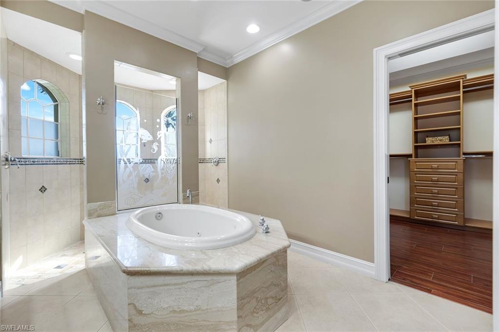 309 Rookery Court Marco Island, FL 34145 - Photo 24 of 49 a bathroom with a sink and a mirror