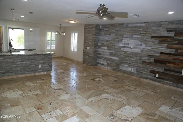 a view of an empty room and a bathroom