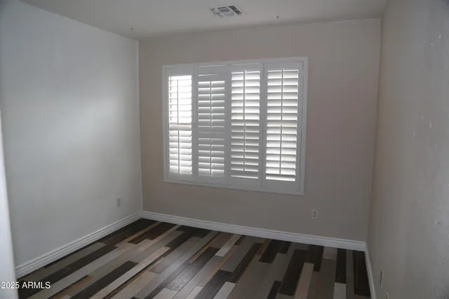 a view of an empty room and window